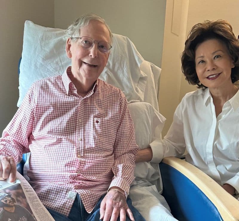 The analyzed proof-of-life photograph: an older man seated beside a woman in a care setting.